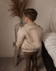 Jogging bomber beige met naam (max 9 letters)